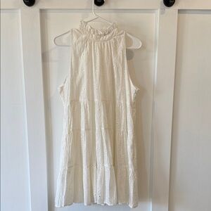 AMELIA’s White Sleeveless Eyelet Dress with ruffle neck detail